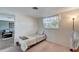 Comfortable bedroom with carpet and a window providing natural light at 260 Venice East Blvd, Venice, FL 34293