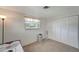 Bright bedroom with a closet and a window with blinds at 260 Venice East Blvd, Venice, FL 34293