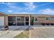 Inviting single-story home featuring a cozy front porch, well-maintained lawn, and charming curb appeal at 260 Venice East Blvd, Venice, FL 34293