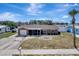 Charming single-story home featuring a well-manicured lawn, attached garage, and inviting front porch at 260 Venice East Blvd, Venice, FL 34293