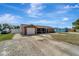 Charming single-story home with a well-maintained lawn and driveway, and an attached single-car garage at 260 Venice East Blvd, Venice, FL 34293