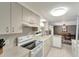 Well-lit kitchen featuring white appliances and plenty of counter space at 260 Venice East Blvd, Venice, FL 34293
