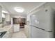 Functional kitchen space offering modern appliances and access to the dining room at 260 Venice East Blvd, Venice, FL 34293