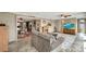 Inviting living room connects to a dining area, kitchen, and includes a fireplace at 260 Venice East Blvd, Venice, FL 34293