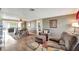 Spacious living room with laminate flooring adjacent to the dining area at 260 Venice East Blvd, Venice, FL 34293