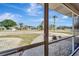 Relaxing screened porch with exterior neighborhood views and decorative gravel at 260 Venice East Blvd, Venice, FL 34293