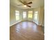 Bright bedroom featuring wood-look floors and lots of natural light at 27752 Ravens Brook Rd, Wesley Chapel, FL 33544