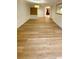 Bright living room with light colored wood flooring and recessed lighting at 27752 Ravens Brook Rd, Wesley Chapel, FL 33544