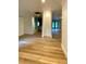 Spacious living area with light wood floors with architectural features at 27752 Ravens Brook Rd, Wesley Chapel, FL 33544