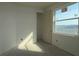 An unfinished bedroom with a bright window and a walk-in closet at 2824 Marrakesh Ln, Sarasota, FL 34234