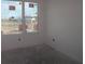 A bright unfinished bedroom with a large window at 2824 Marrakesh Ln, Sarasota, FL 34234