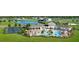 Resort-style community pool and clubhouse with tennis courts overlooking a scenic pond at 2824 Marrakesh Ln, Sarasota, FL 34234