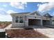 Charming home featuring stone accents, a spacious garage, and a well-lit exterior at 2824 Marrakesh Ln, Sarasota, FL 34234