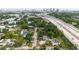 Aerial view of property with highway nearby and downtown skyline in background at 2825 N Taliaferro N Ave, Tampa, FL 33602