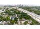 Aerial view of property with highway nearby and downtown skyline in background at 2825 N Taliaferro N Ave, Tampa, FL 33602