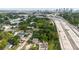 Aerial view of property with highway nearby and downtown skyline in background at 2825 N Taliaferro N Ave, Tampa, FL 33602
