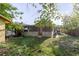 Backyard view of the home with a small covered porch and adjacent covered parking at 2825 N Taliaferro N Ave, Tampa, FL 33602