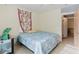 Cozy bedroom featuring tile floors, a colorful curtain, and a crib at 2825 N Taliaferro N Ave, Tampa, FL 33602