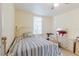 Bright bedroom featuring tile floors, a window, and a dresser at 2825 N Taliaferro N Ave, Tampa, FL 33602