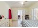Bright bedroom features tile floors, a window, and a door at 2825 N Taliaferro N Ave, Tampa, FL 33602