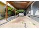View of the covered carport, protecting a minivan from the elements at 2825 N Taliaferro N Ave, Tampa, FL 33602