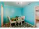 Small dining room with four chairs and a blue color scheme at 2825 N Taliaferro N Ave, Tampa, FL 33602