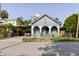 Bungalow-style home featuring covered carport and quaint fenced front yard at 2825 N Taliaferro N Ave, Tampa, FL 33602