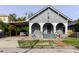 Charming bungalow-style home with a covered carport and front porch arches at 2825 N Taliaferro N Ave, Tampa, FL 33602