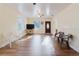 Spacious living room with wood-look flooring, ceiling fans, and natural light at 2825 N Taliaferro N Ave, Tampa, FL 33602