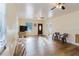 Spacious living room with wood-look flooring, ceiling fans, and natural light at 2825 N Taliaferro N Ave, Tampa, FL 33602