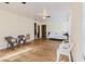 Bright living room featuring neutral walls, wood floors, and ceiling fans at 2825 N Taliaferro N Ave, Tampa, FL 33602