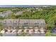 A high angle view of newer townhomes with palm trees and manicured lawns at 3147 Oyster Bayou Way, Clearwater, FL 33759