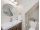Stylish half bathroom with sleek fixtures, a white countertop sink, and a decorative mirror at 3147 Oyster Bayou Way, Clearwater, FL 33759