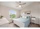 Cozy bedroom with a large window offering natural light and an off-white color scheme at 3147 Oyster Bayou Way, Clearwater, FL 33759