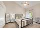 Charming bedroom featuring a vaulted ceiling, ceiling fan, and balcony access at 3147 Oyster Bayou Way, Clearwater, FL 33759