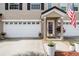 Inviting home exterior showcasing a well-kept lawn, a cozy porch, and an attached two-car garage at 3147 Oyster Bayou Way, Clearwater, FL 33759