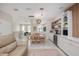 Open floor plan featuring a dining area, kitchen, and living space, ideal for modern living and entertaining at 3147 Oyster Bayou Way, Clearwater, FL 33759