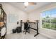 Bright home office with a sit stand desk, ergonomic chair, and natural light at 3147 Oyster Bayou Way, Clearwater, FL 33759