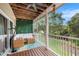 Relaxing screened-in patio with comfortable seating, decorative lights, and a tranquil view of the outdoors at 3147 Oyster Bayou Way, Clearwater, FL 33759
