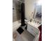 Bathroom featuring vanity with granite countertop and shower with dark curtain at 3632 15Th S Ave, St Petersburg, FL 33711