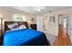 Inviting bedroom with wood floors, a ceiling fan, and ample natural light at 39243 6Th Ave, Zephyrhills, FL 33542