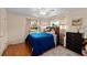 Cozy bedroom with wood floors, ceiling fan and bright natural light at 39243 6Th Ave, Zephyrhills, FL 33542