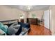Bedroom with wooden floors, a window and a wooden dresser at 39243 6Th Ave, Zephyrhills, FL 33542