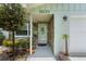 Welcoming front entrance with a stone accent wall and a decorative door at 39243 6Th Ave, Zephyrhills, FL 33542