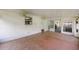 Covered lanai with neutral tile flooring, ideal for outdoor dining or lounging at 39243 6Th Ave, Zephyrhills, FL 33542