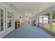 Bright sunroom with white walls and lots of windows, perfect for relaxation and play at 39243 6Th Ave, Zephyrhills, FL 33542