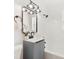 Bathroom with vanity, shower over bath and modern lighting fixtures at 4012 W Pearl Ave, Tampa, FL 33611