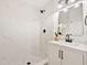 Modern bathroom with marble shower and stylish vanity with decor at 4012 W Pearl Ave, Tampa, FL 33611