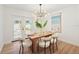 Elegant dining room with stylish table setting, modern lighting, and natural light at 4012 W Pearl Ave, Tampa, FL 33611