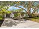 Attractive single-Gathering home featuring a well-maintained front yard and a spacious driveway at 4012 W Pearl Ave, Tampa, FL 33611